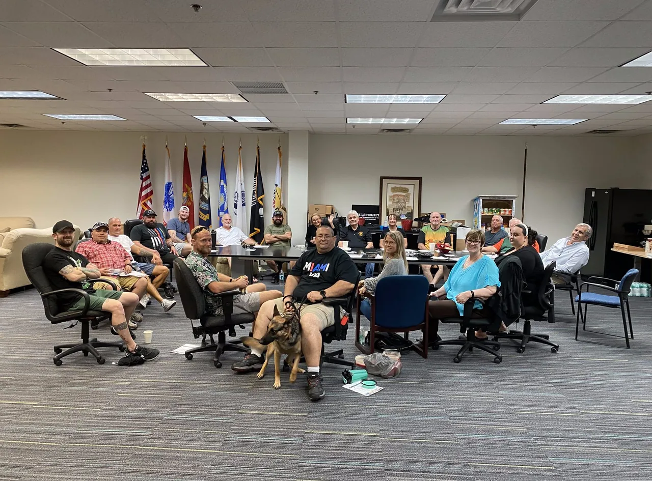 A veteran cohort meeting with case managers