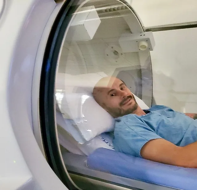 Veteran resting inside a hyperbaric chamber