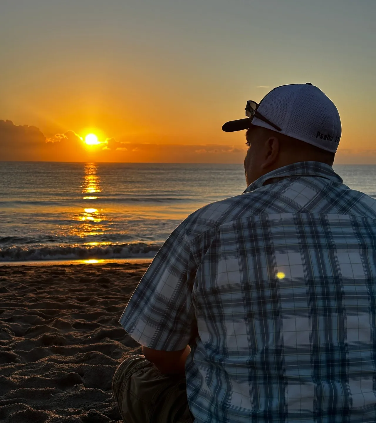 A veteran watching the sunrise over the ocean